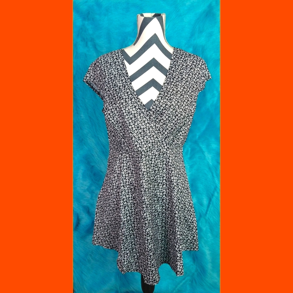 Black flow dress with small white floral detail